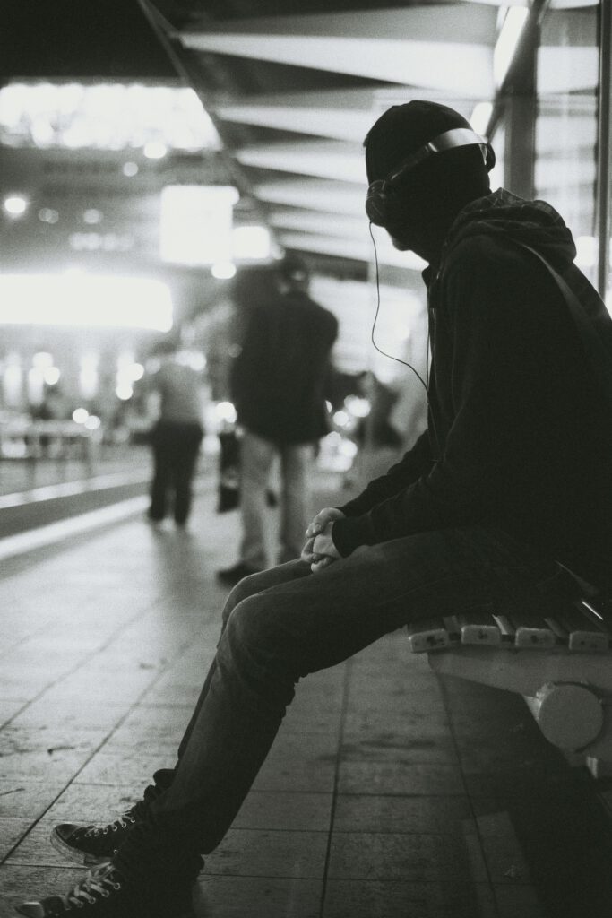 Man waiting for a train by Max Wolf